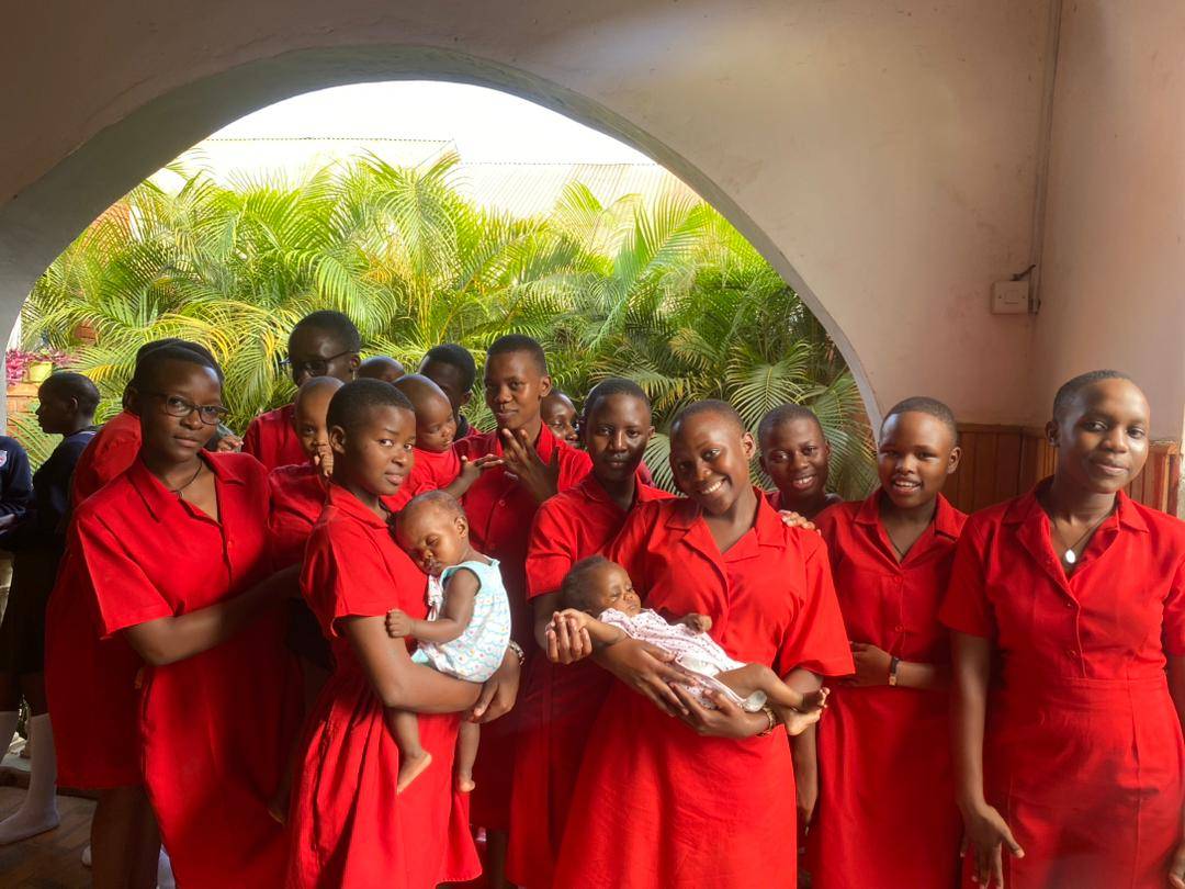 students holding babies